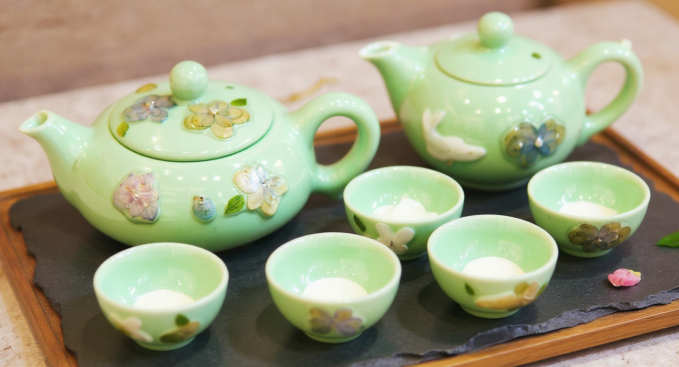 Close-Up of Celadon Teacup Showing Real Pressed Winter Jasmine Petals and 3D Koi Interior