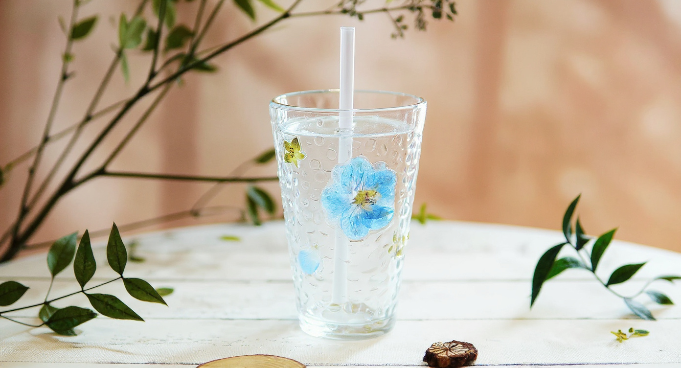 Handmade Pressed Flower Glass Cup Set with lid and straw flat lay gift display.